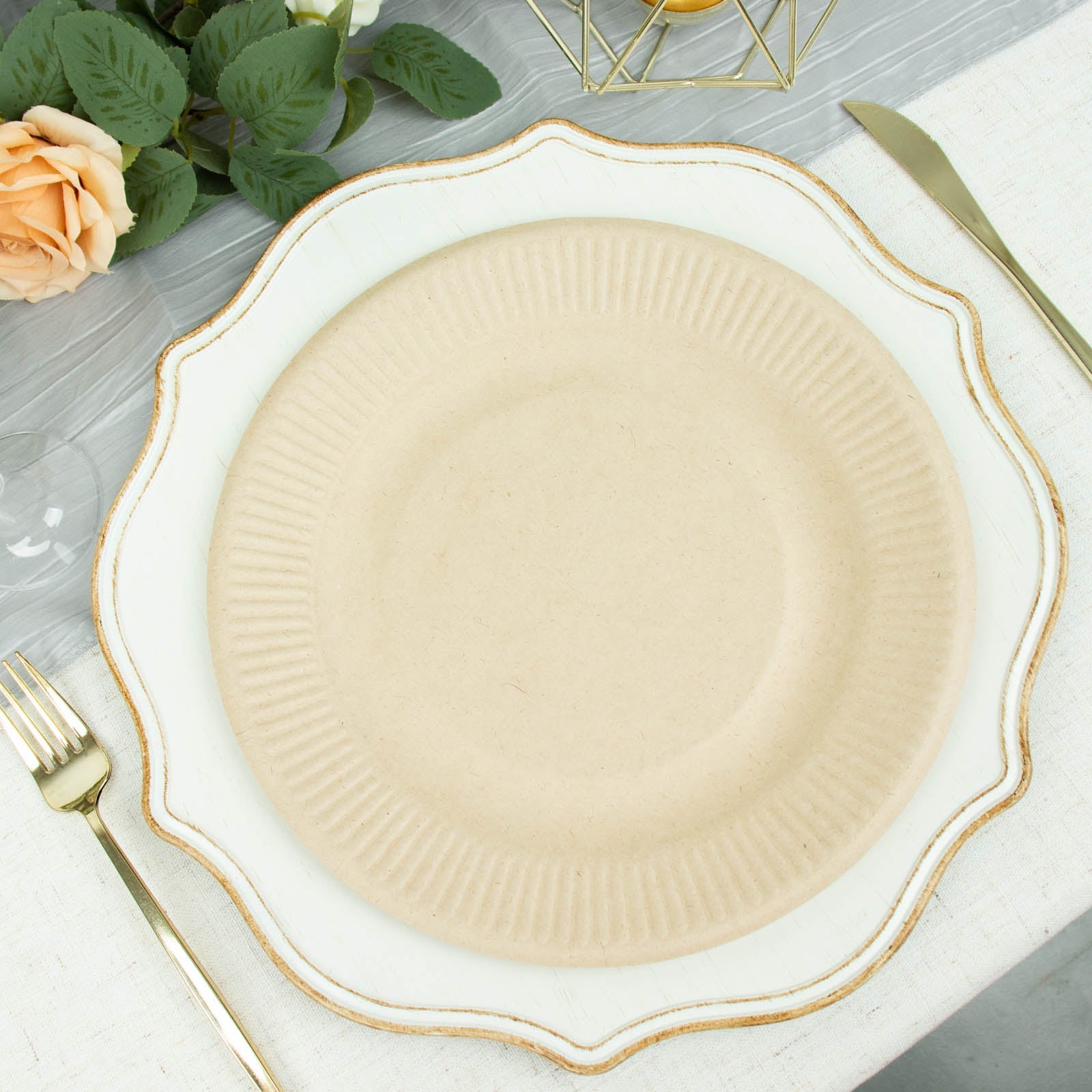 Natural biodegradable bagasse dinner plate in light beige on a decorative table setting.