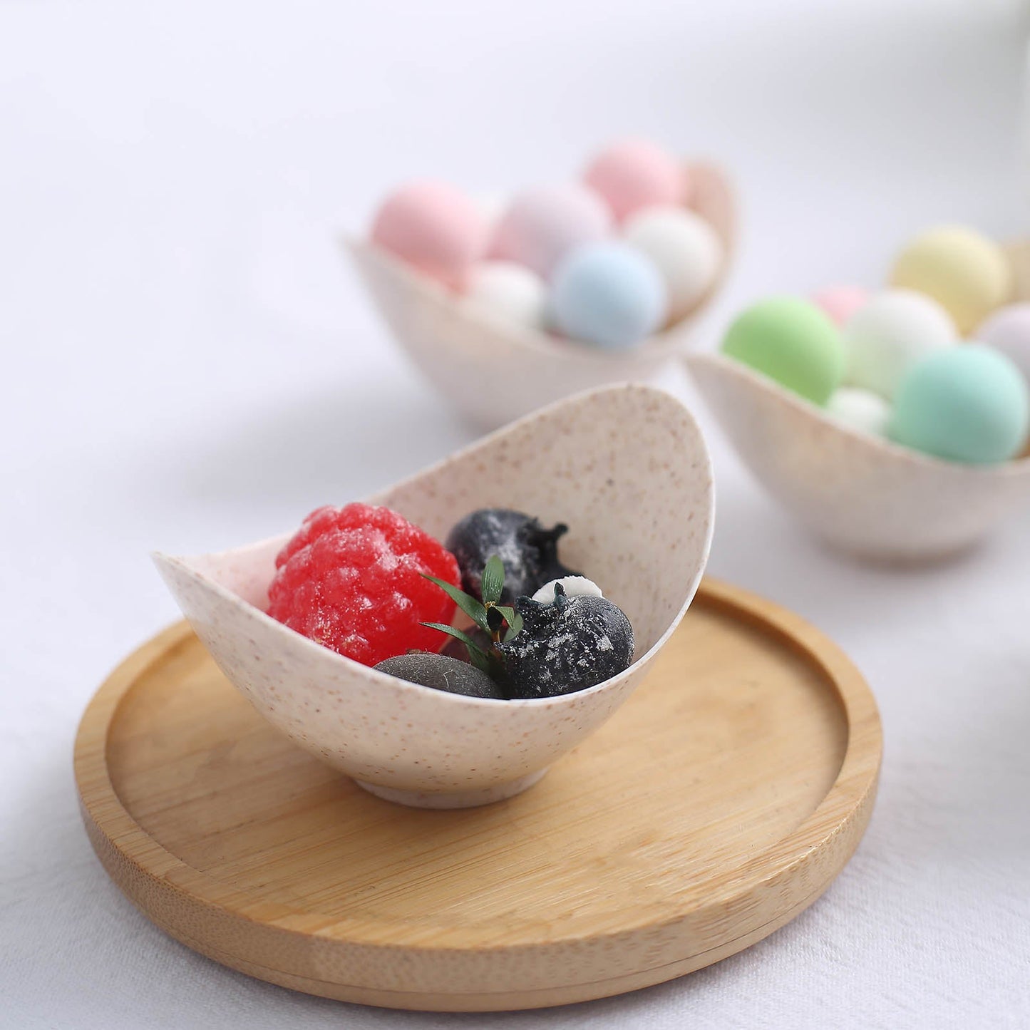 Natural beige mini biodegradable ice cream scoop bowl with dessert.
