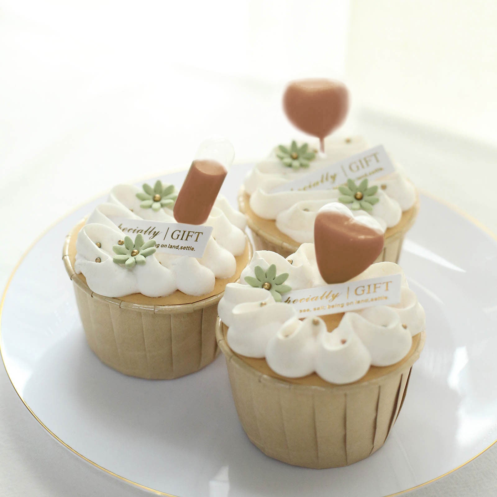 Clear plastic dessert topper pipettes on cupcakes, perfect for festive occasions.