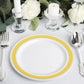 White 7" round plates with gold and silver rim, set on a table setting.