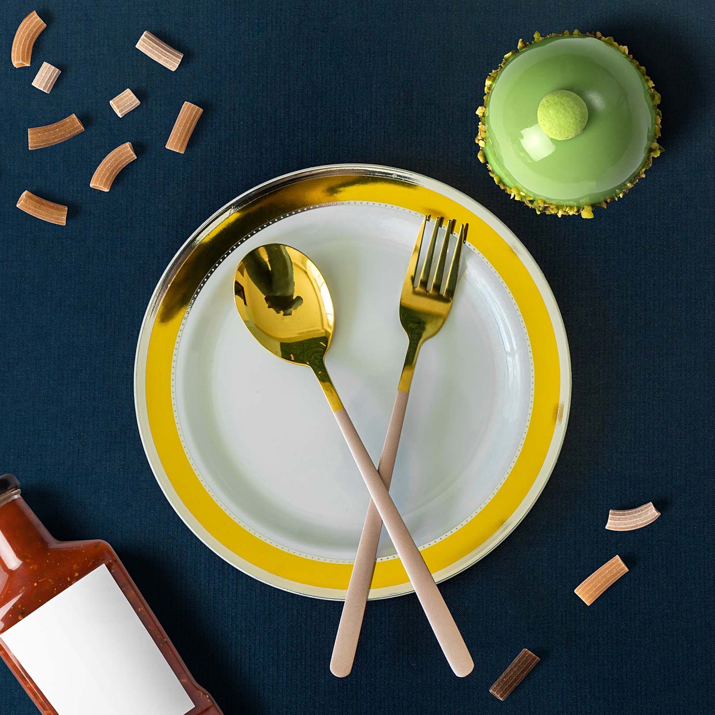 White round disposable dessert plates with gold rim.