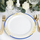 White dinner plate with royal blue rim and gold vine design.