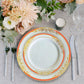 White with red rim plastic appetizer plate with gold vine design.