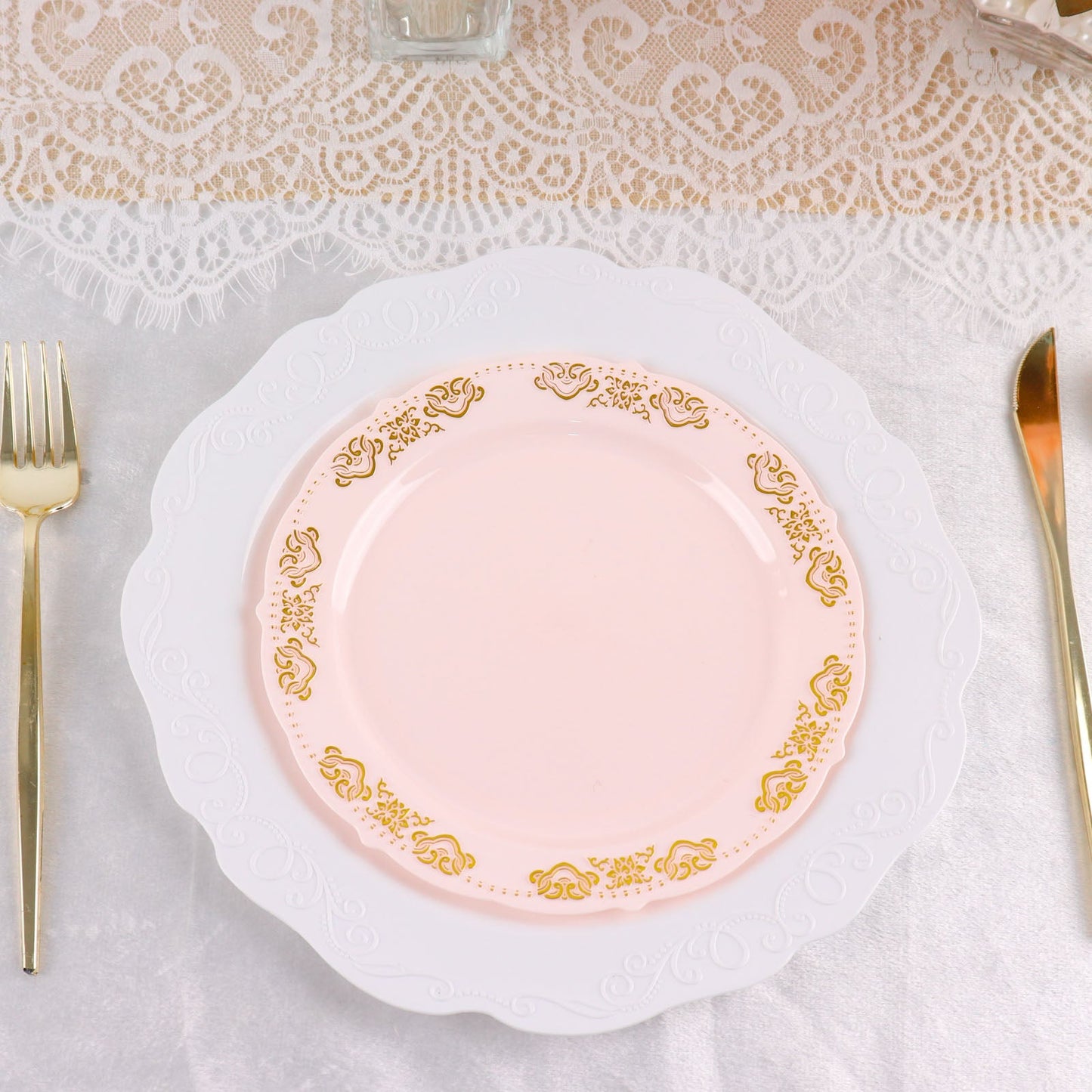 Gold embossed blush appetizer plate with scalloped edges.