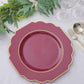 Burgundy hard plastic Baroque dinner plate with gold rim.