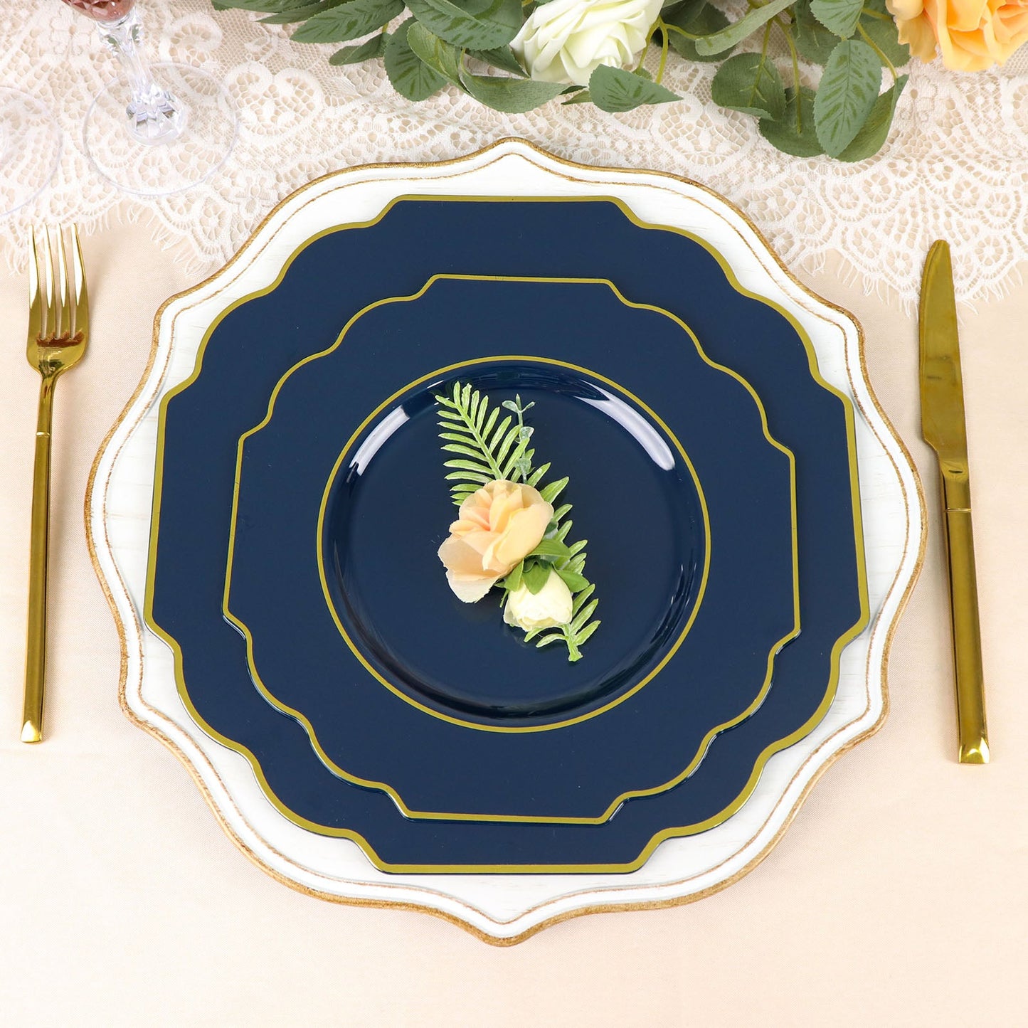 Navy blue heavy-duty dessert plate with gold rim on a decorated table.