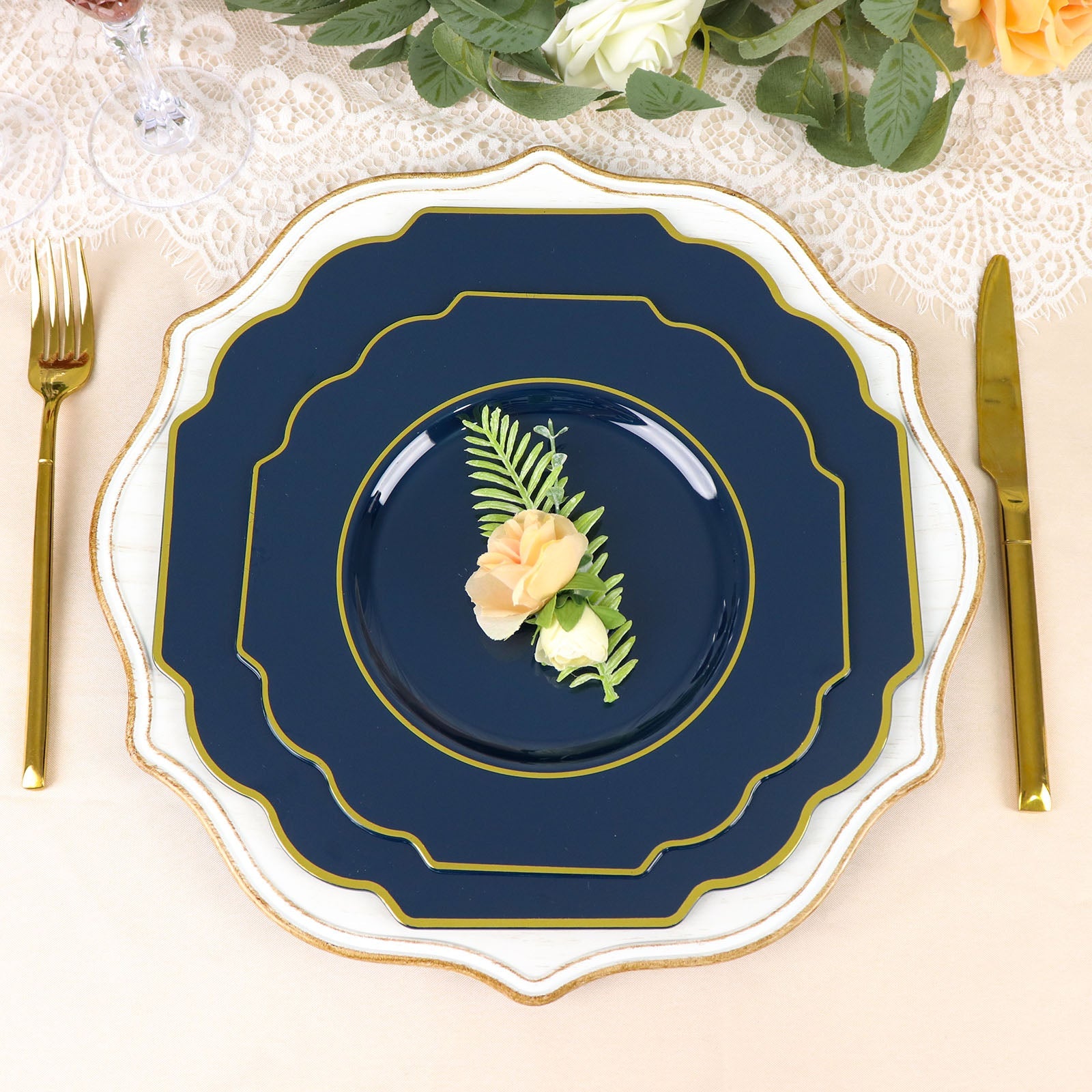 Navy blue heavy-duty dessert plate with gold rim on a decorated table.
