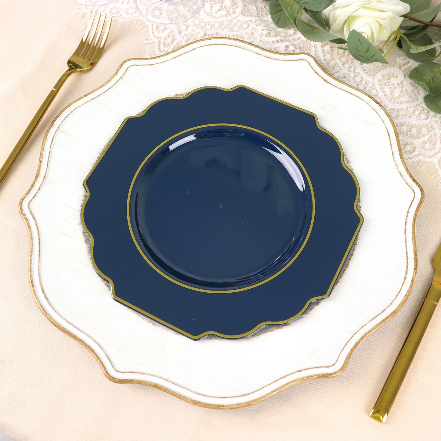 Navy blue disposable dessert plates with gold rim on a decorative table setting.