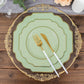 Sage green dessert plates with gold rim on a wooden table setting.