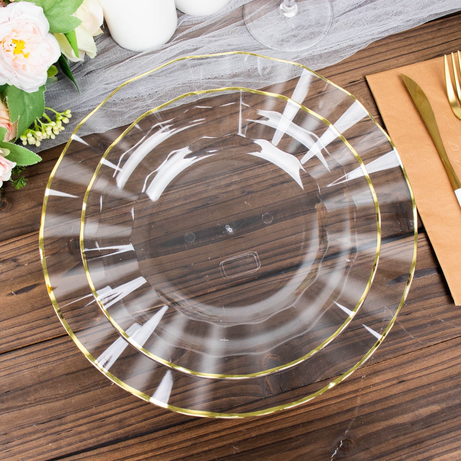 9" clear hard plastic dinner plate with gold ruffled rim.