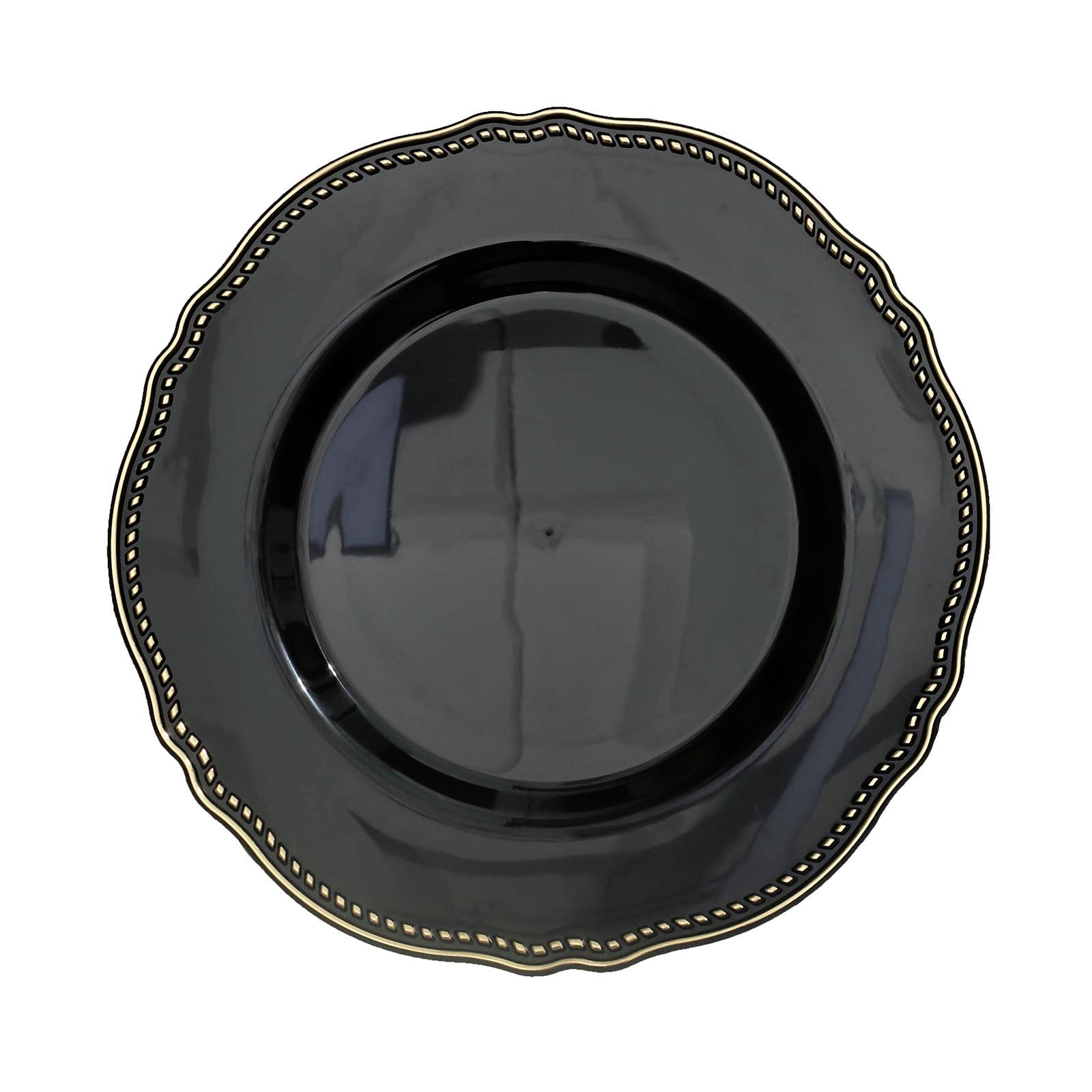 Elegant black plate with gold trim and scalloped edges. Perfect for dining decor.
