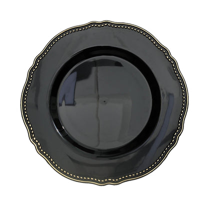 Elegant black plate with gold trim and scalloped edges. Perfect for dining decor.