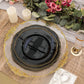 9" black and gold scalloped rim plastic dinner plates on a table setting.