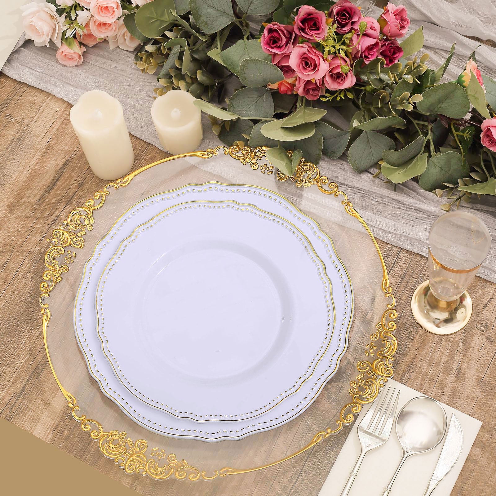 Elegant table setting with gold-accented plates, candles, and roses. Perfect for events.