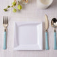 White square geometric ridge trim plastic salad plate on a table setting.