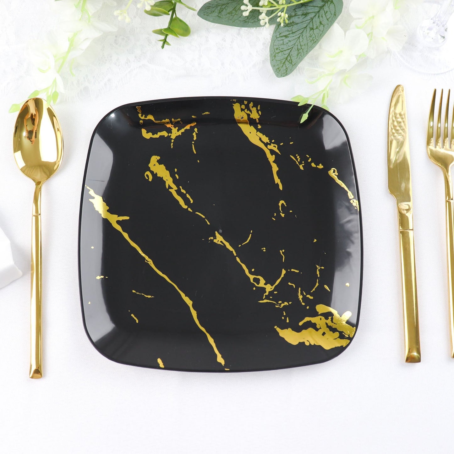 Black and gold marble square disposable dessert plate.