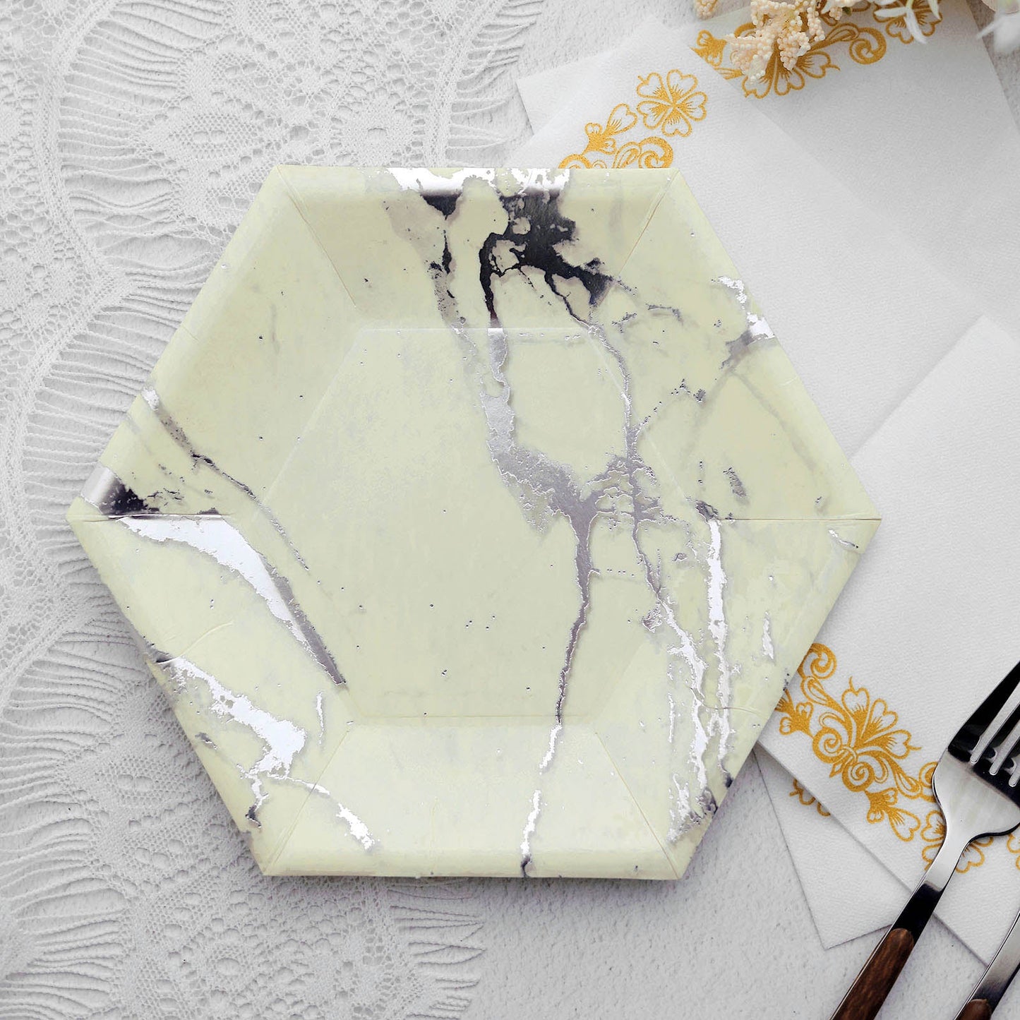 Ivory marble hexagon paper plate with silver foil design.