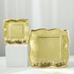 Gold vintage square dinner plates with embossed scroll design.