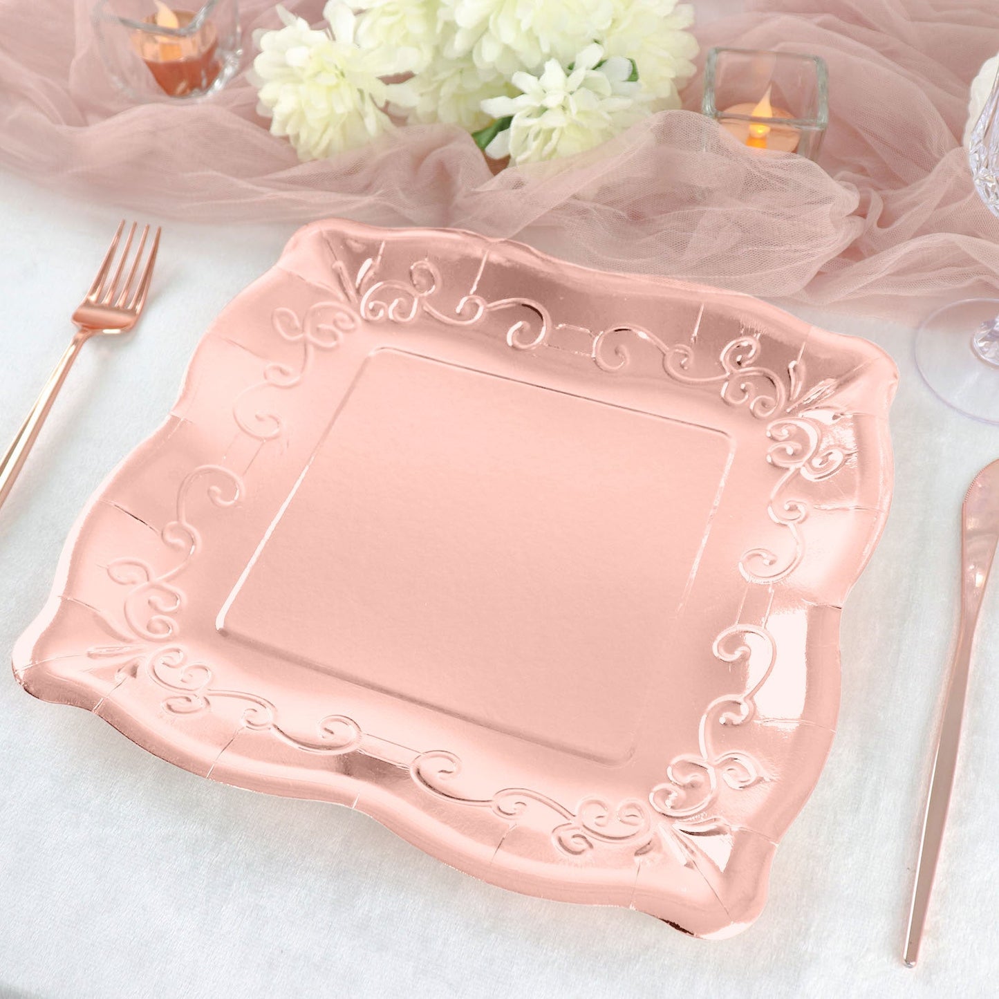 Rose gold vintage square dinner plate with embossed scroll design.