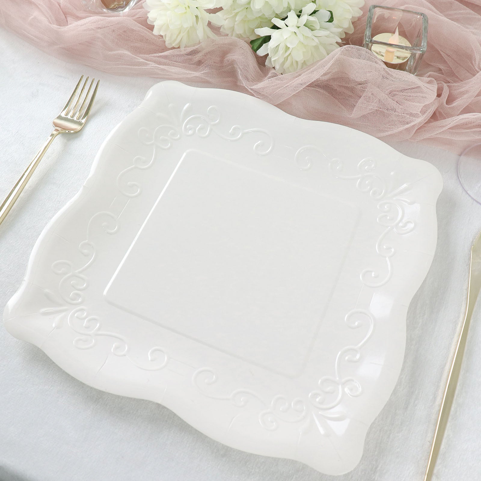 White vintage square dinner serving paper plate with embossed scroll design.