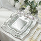 Silver vintage square appetizer plates with embossed scroll design.
