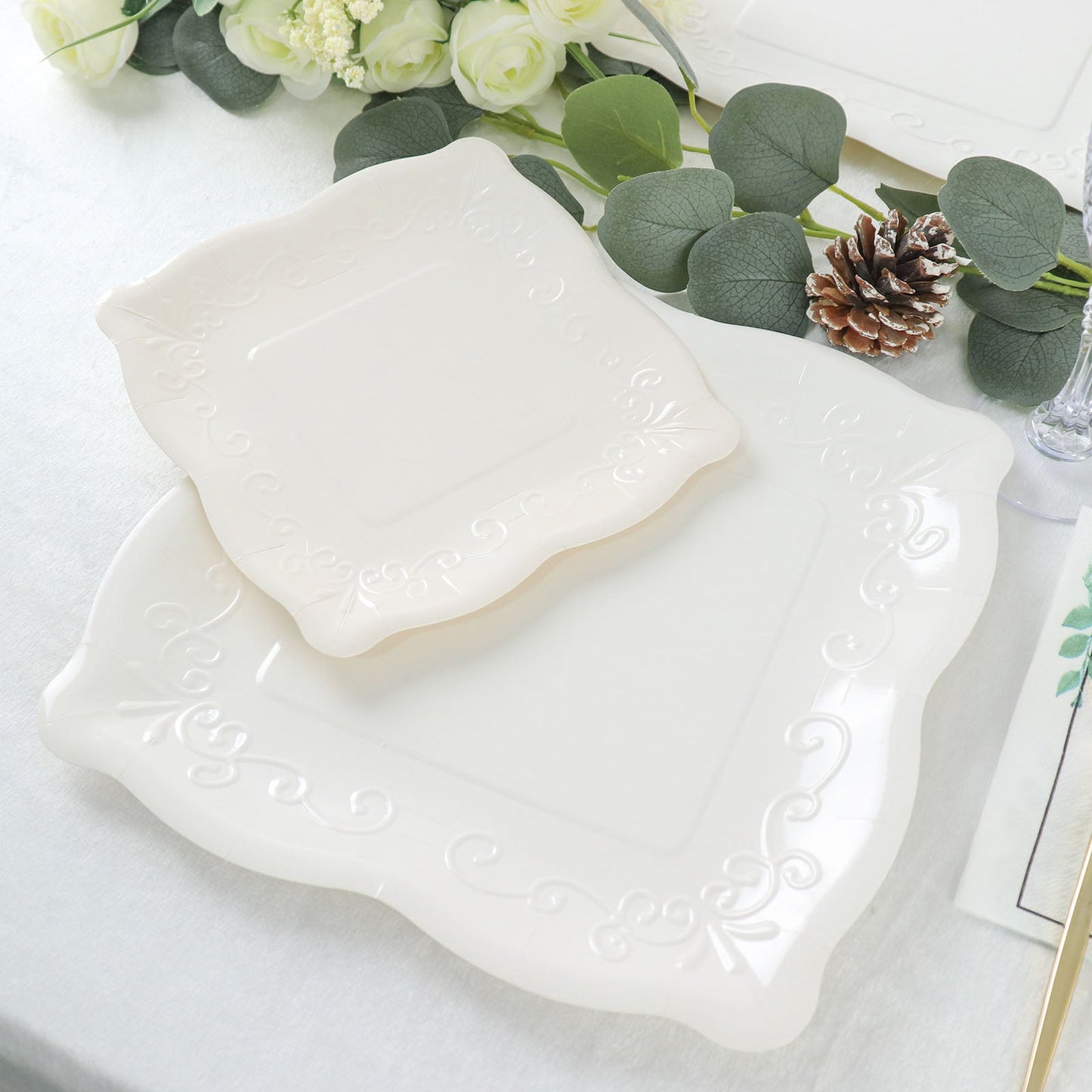 White vintage square appetizer dessert paper plates with embossed scroll design.