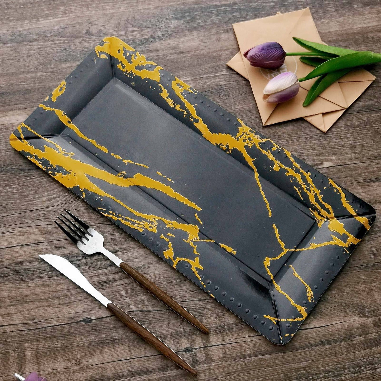 Black and gold marble heavy duty serving tray, 16 inches long.