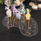 Clear acrylic ice cream cone display stand with mini snow cones.
