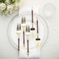 Gold and brown disposable forks with Roman column handles on a plate.