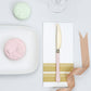 Gold 7.5" heavy duty plastic knife with blush handle on a white napkin.