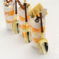 Gold and brown disposable dessert spoons with Roman column handles.