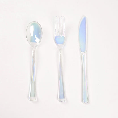 Iridescent disposable cutlery set, including a spoon, fork, and knife.