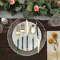 Gold and hunter emerald green disposable utensil set on a decorative plate.