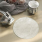 Metallic silver round jar covers with satin tie string for party favors.