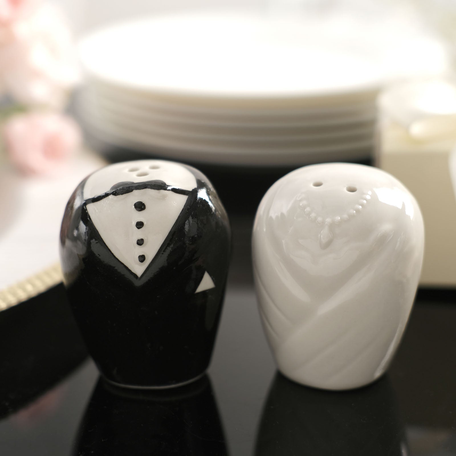 Black and white bride and groom ceramic salt and pepper shakers in a gift box.