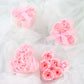 Blush pink rose soap heart party favors in gift boxes with ribbon.