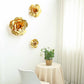 Large metallic gold artificial foam roses for DIY crafts.