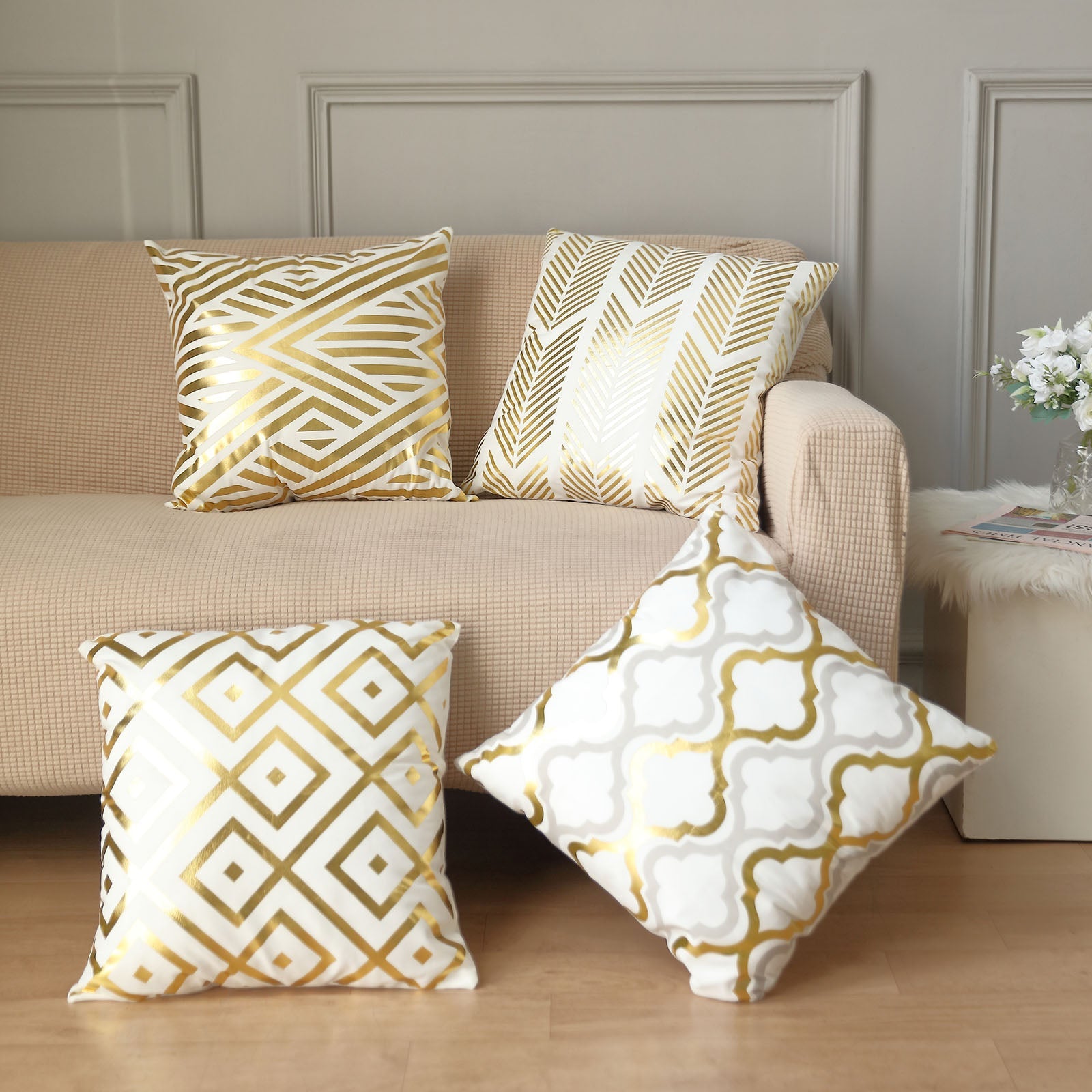 18" White and Gold Foil Geometric Print Throw Pillow Covers on a sofa.