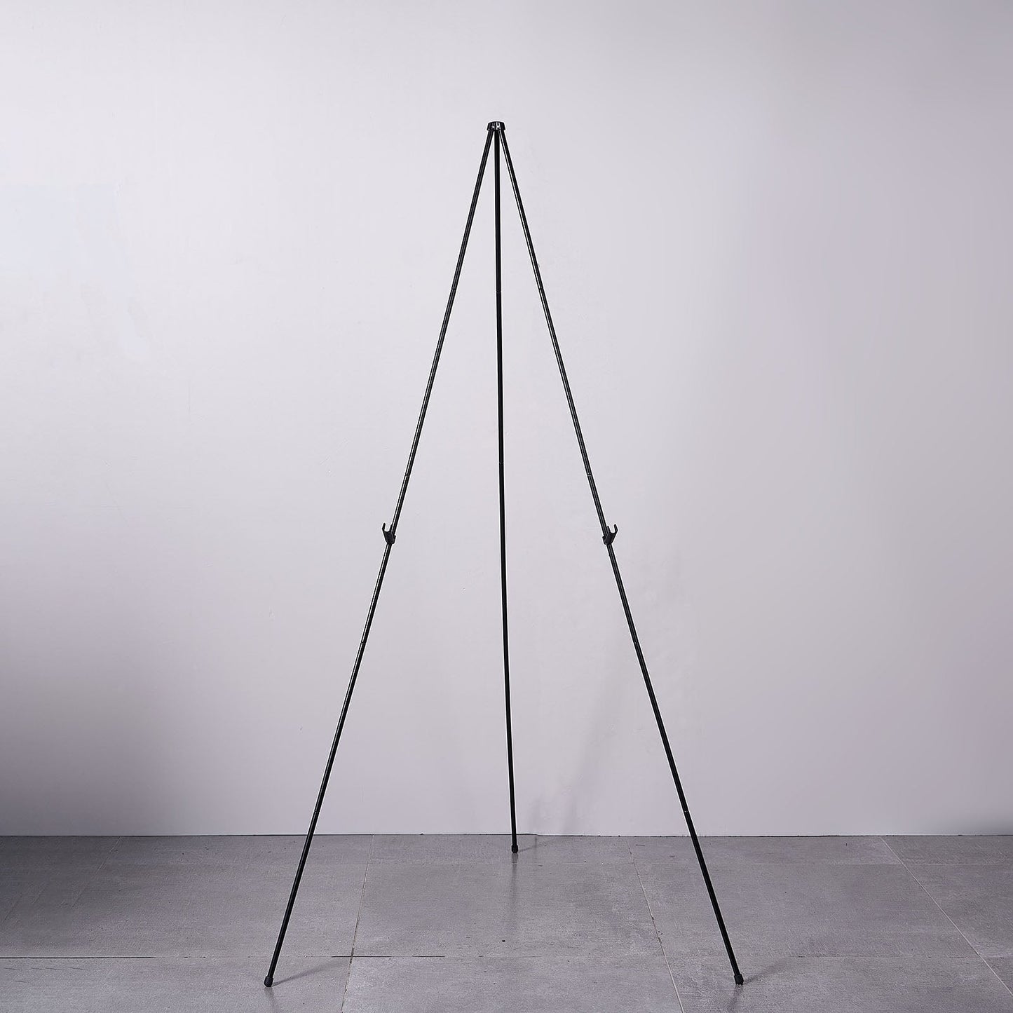 65" black metal sign holder easel stand, collapsible tripod design.