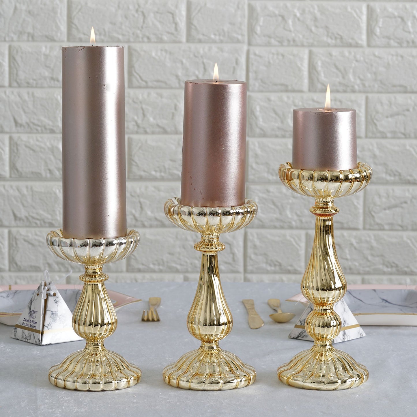 Mercury gold glass candle holders set of 3 with pillar candles.