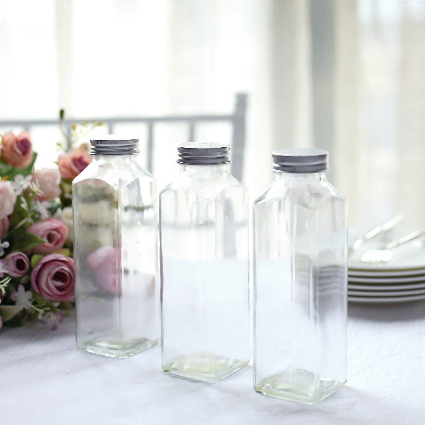 Clear glass jars with aluminum caps, 12oz French square design.