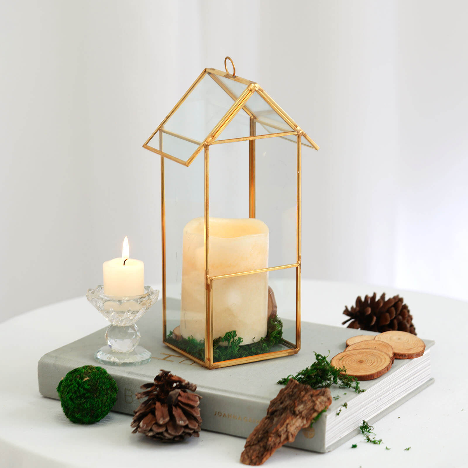 Gold geometric glass terrarium for air plants and candles.