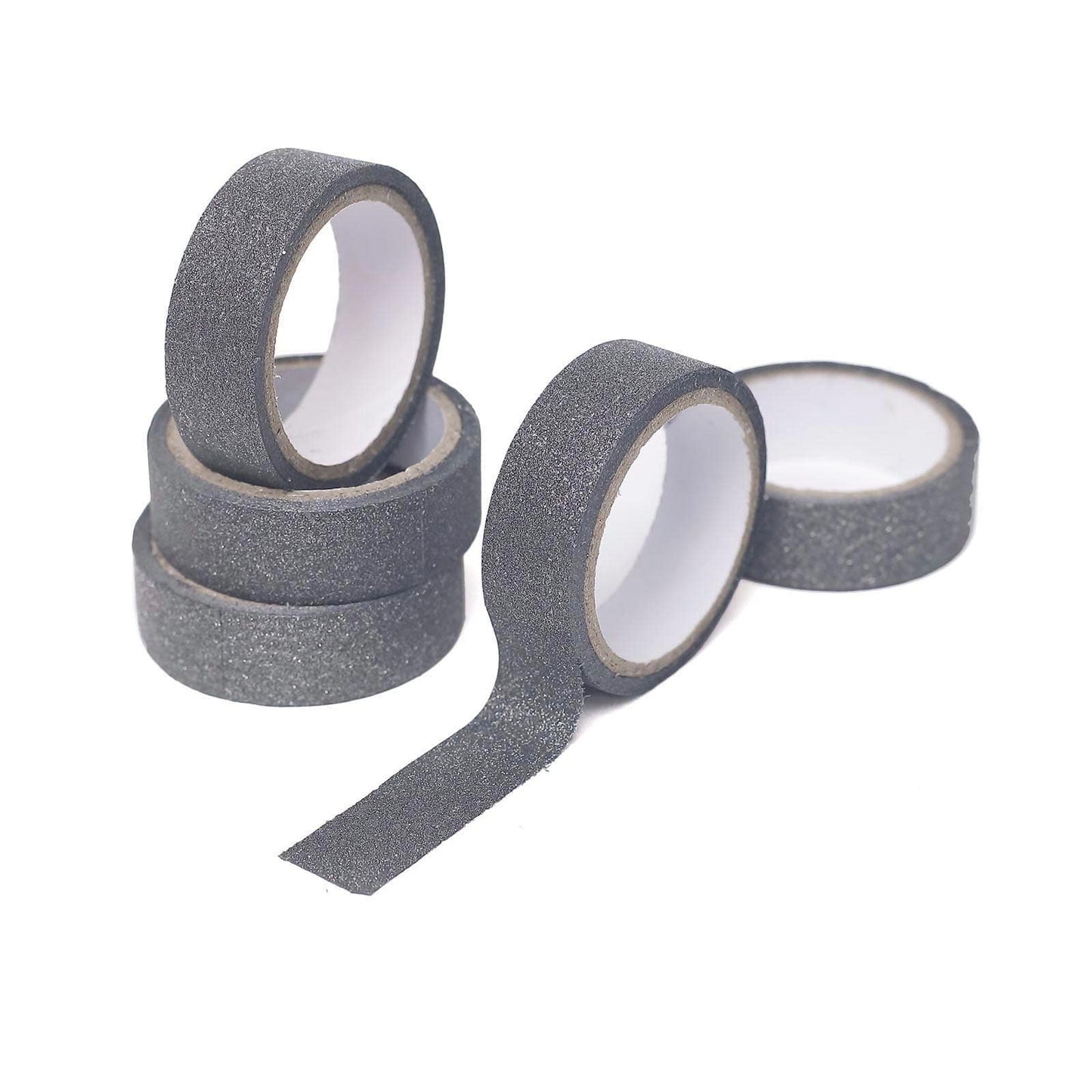 Charcoal gray glitter washi tape rolls stacked on a white background.