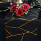 9ft black table runner with gold foil geometric pattern.