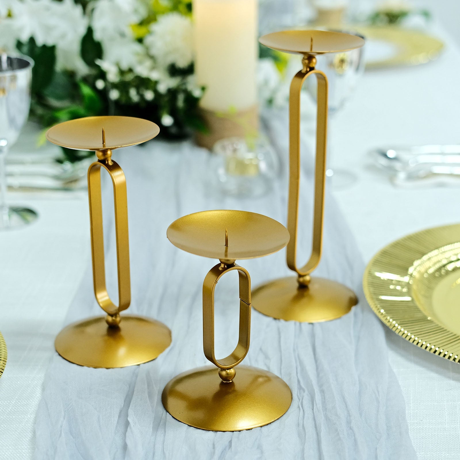 Gold metal oval frame pillar candle holder stands, assorted sizes.
