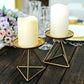 Gold metal triangle base candle holders with pillar candles.