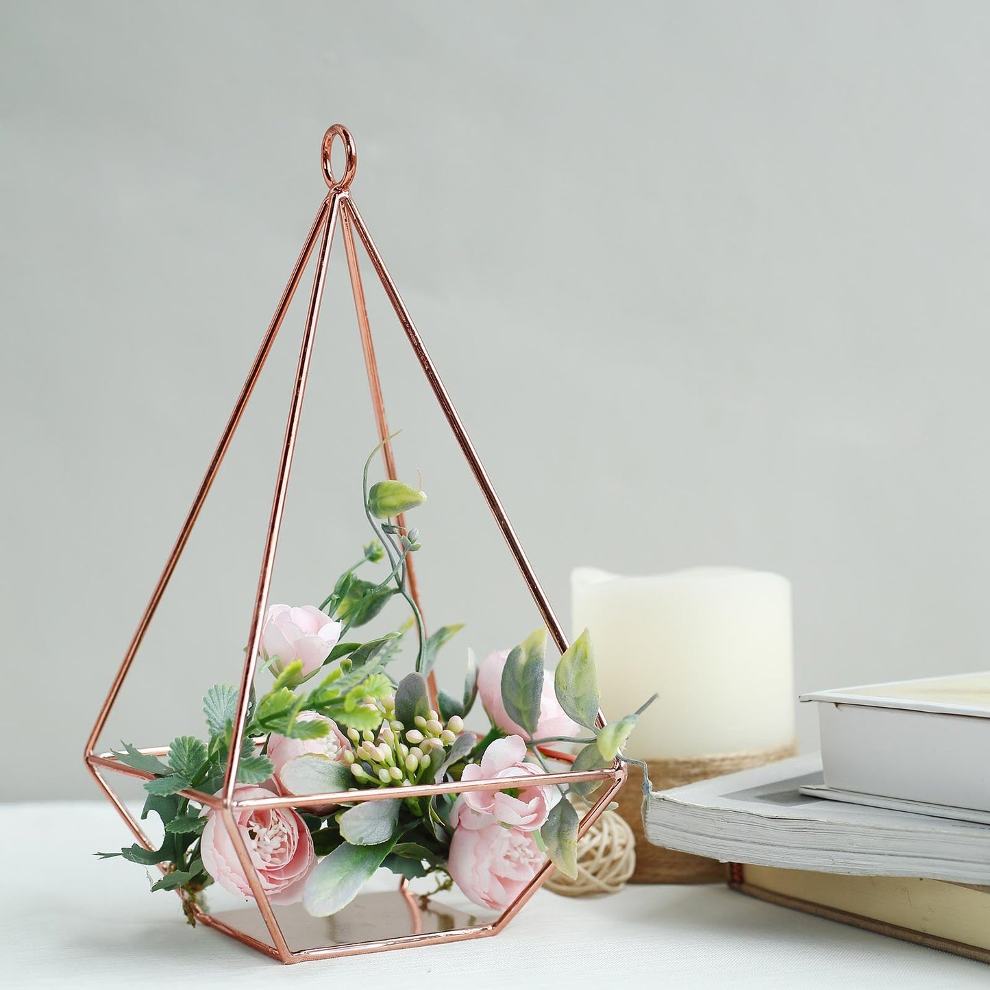 Rose gold geometric tealight candle holder with flowers.