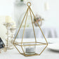 9" gold metal pyramid tealight candle holder with geometric design.