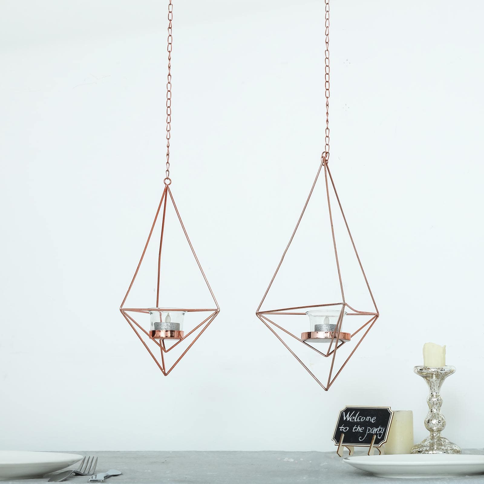 Rose gold hanging diamond tealight candle holders in geometric flower design.