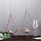 Rose gold geometric tealight candle holders in open frame design.